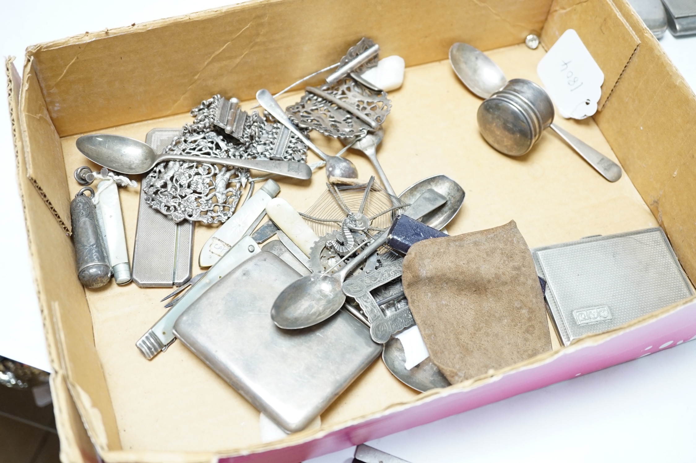 A quantity of assorted collectable silver items, including cigarette cases, vesta cases, teaspoons, fruit knives, buckles, purses, pig pin cushion, 19th century Russian caddy spoon, 800 box and cover, etc. Condition - po